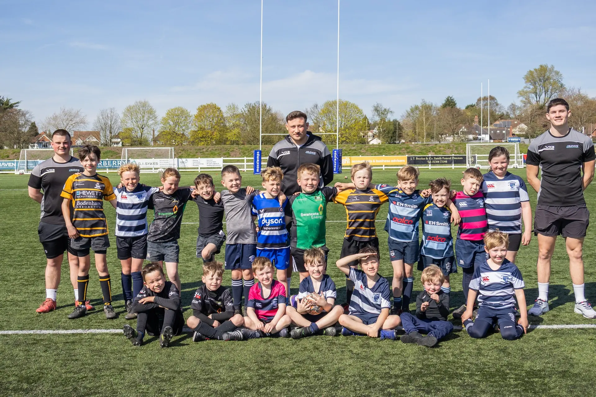 The Elevate coaching team together with a group of young players