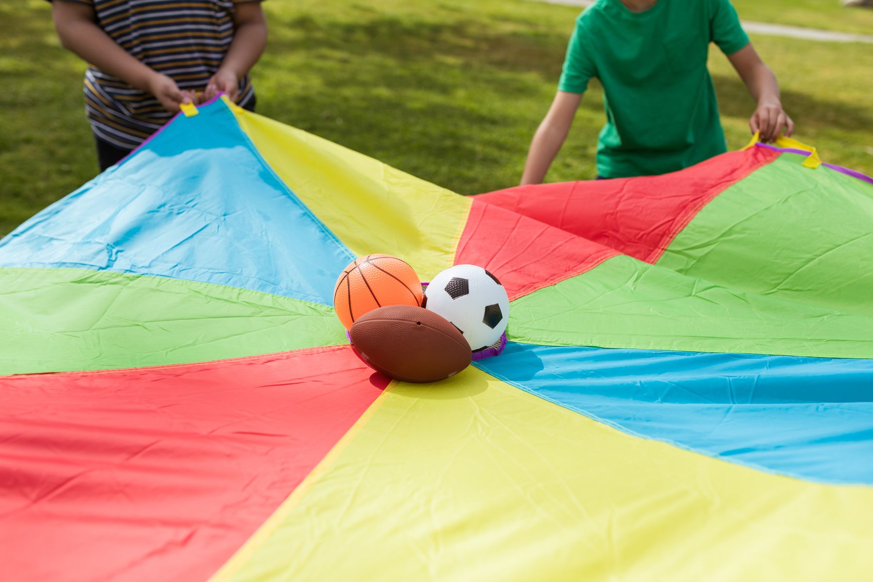 Children enjoying a colourful outdoor multi-sport party activity